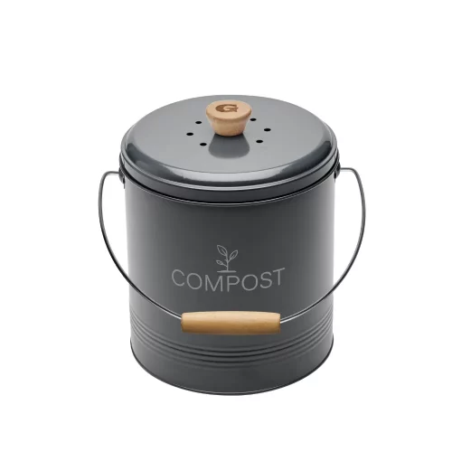 seau à compost de cuisine gris au design retro avec une poignée en bois avec un G pour la marque Guillouard