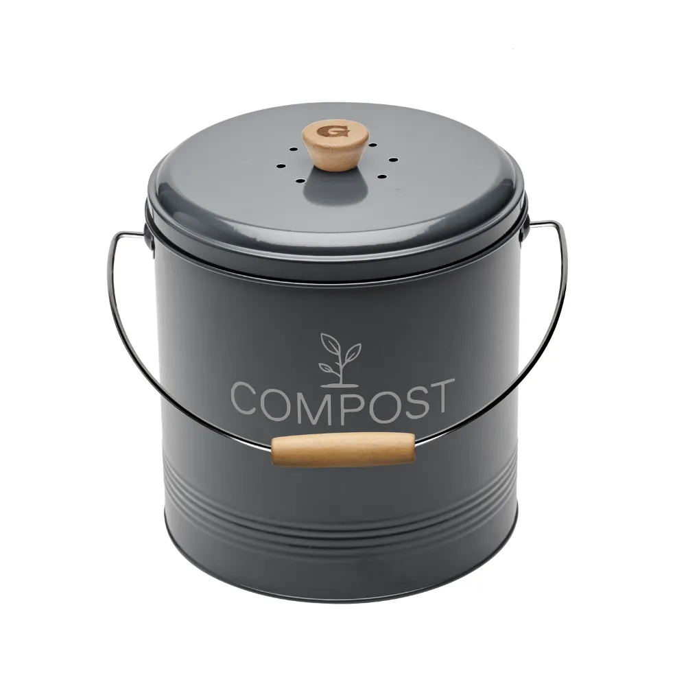 seau à compost de cuisine gris au design retro avec une poignée en bois avec un G pour la marque Guillouard